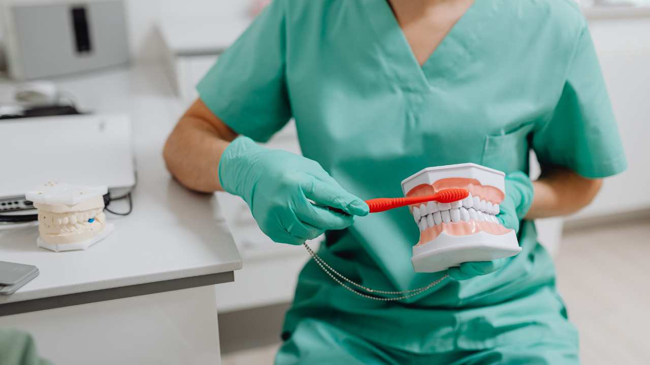 Dentist brushing teeth